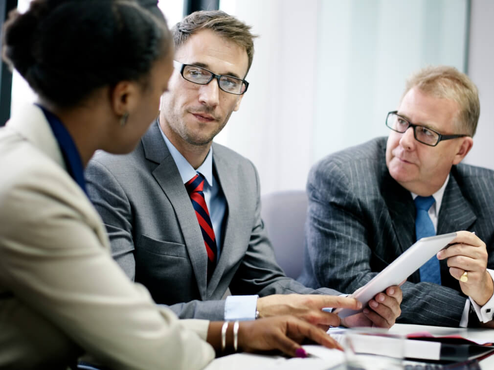 Consulting professionals collaborating around a table